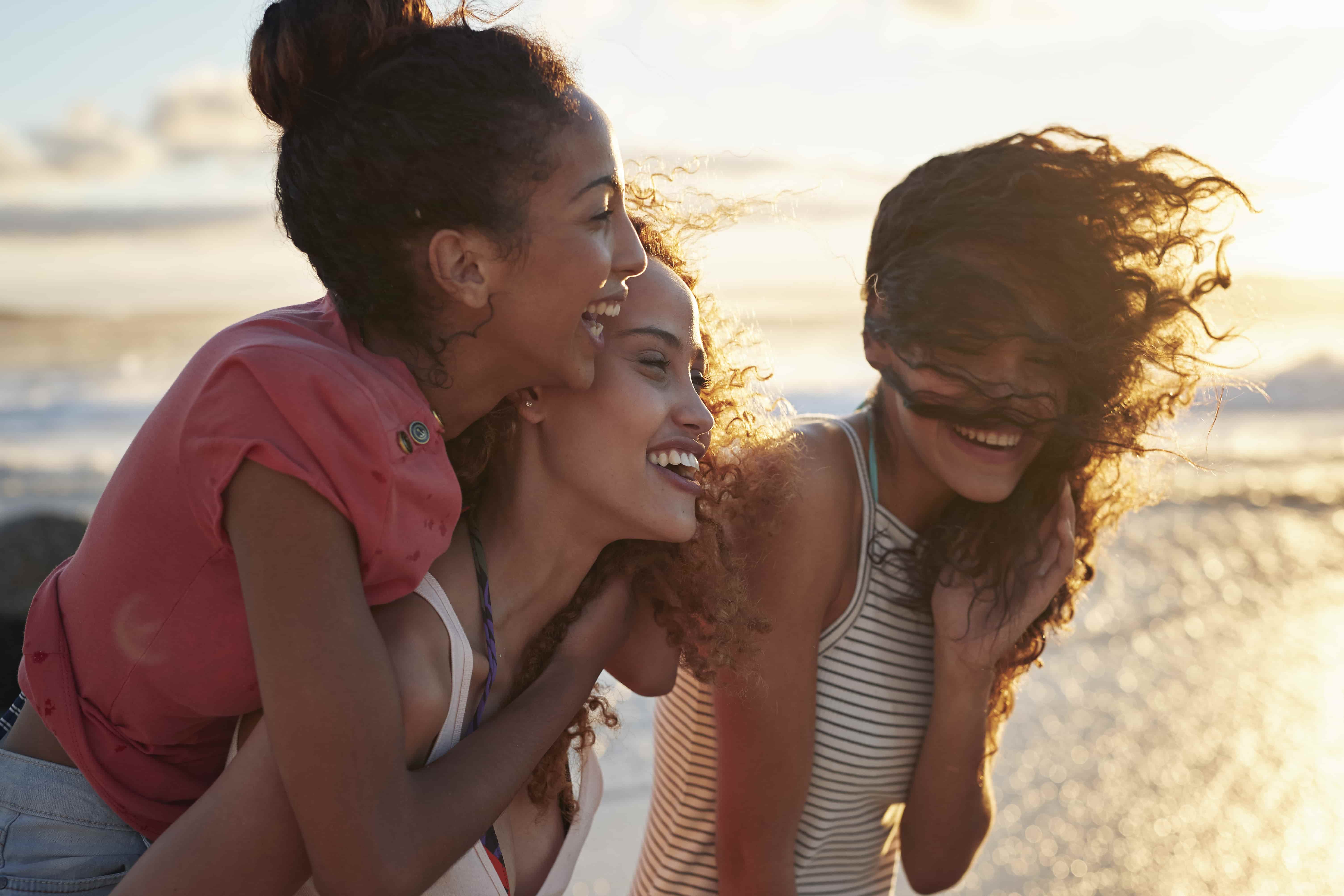 friends laughing on the beach