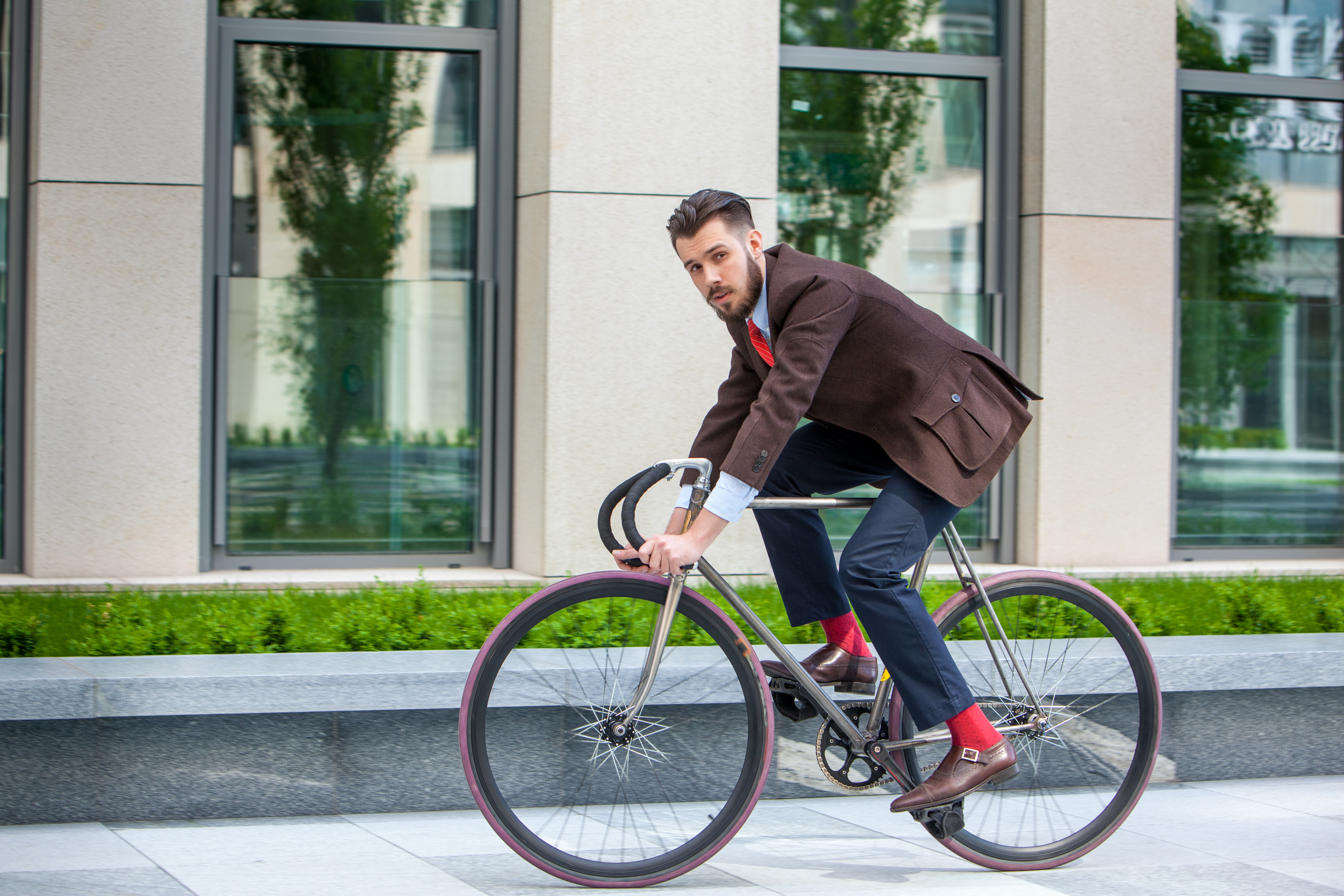 Handsome businessman and his bicycle