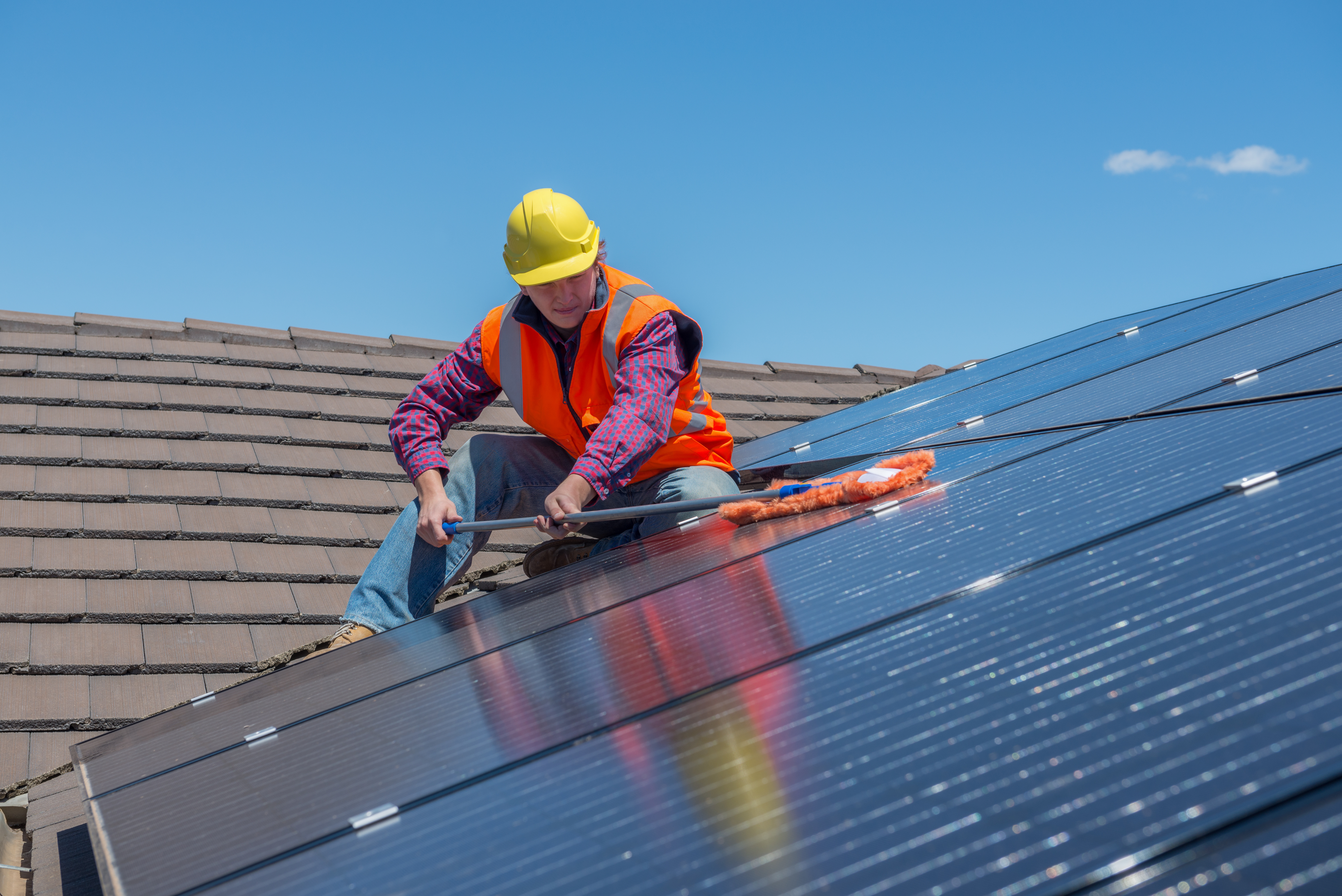 worker and solar panels