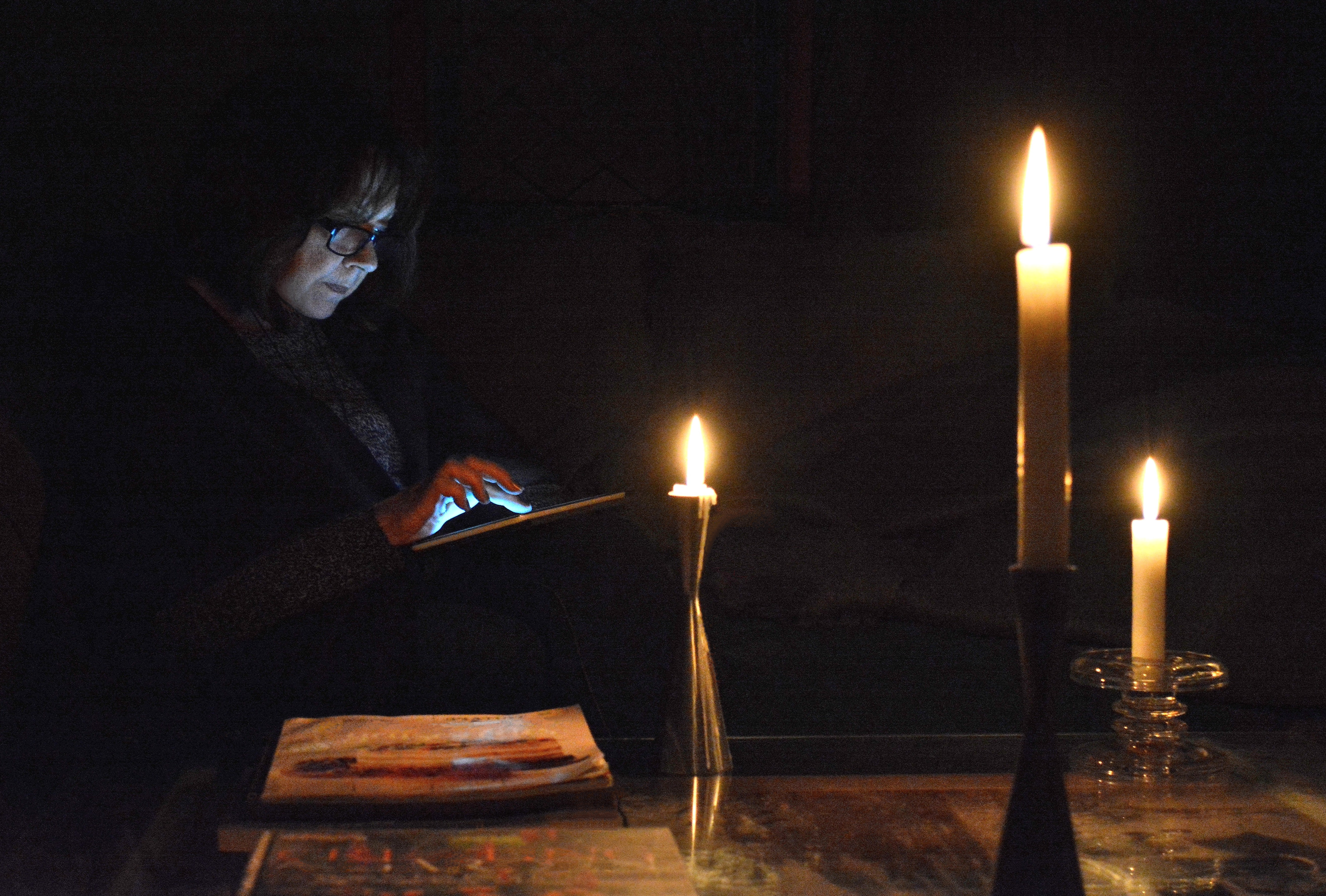 Lifestyle, " Power Failure, Reading by Candlelight "