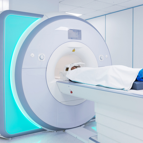 Female patient undergoing MRI - Magnetic resonance imaging in Hospital. Medical Equipment and Health Care.