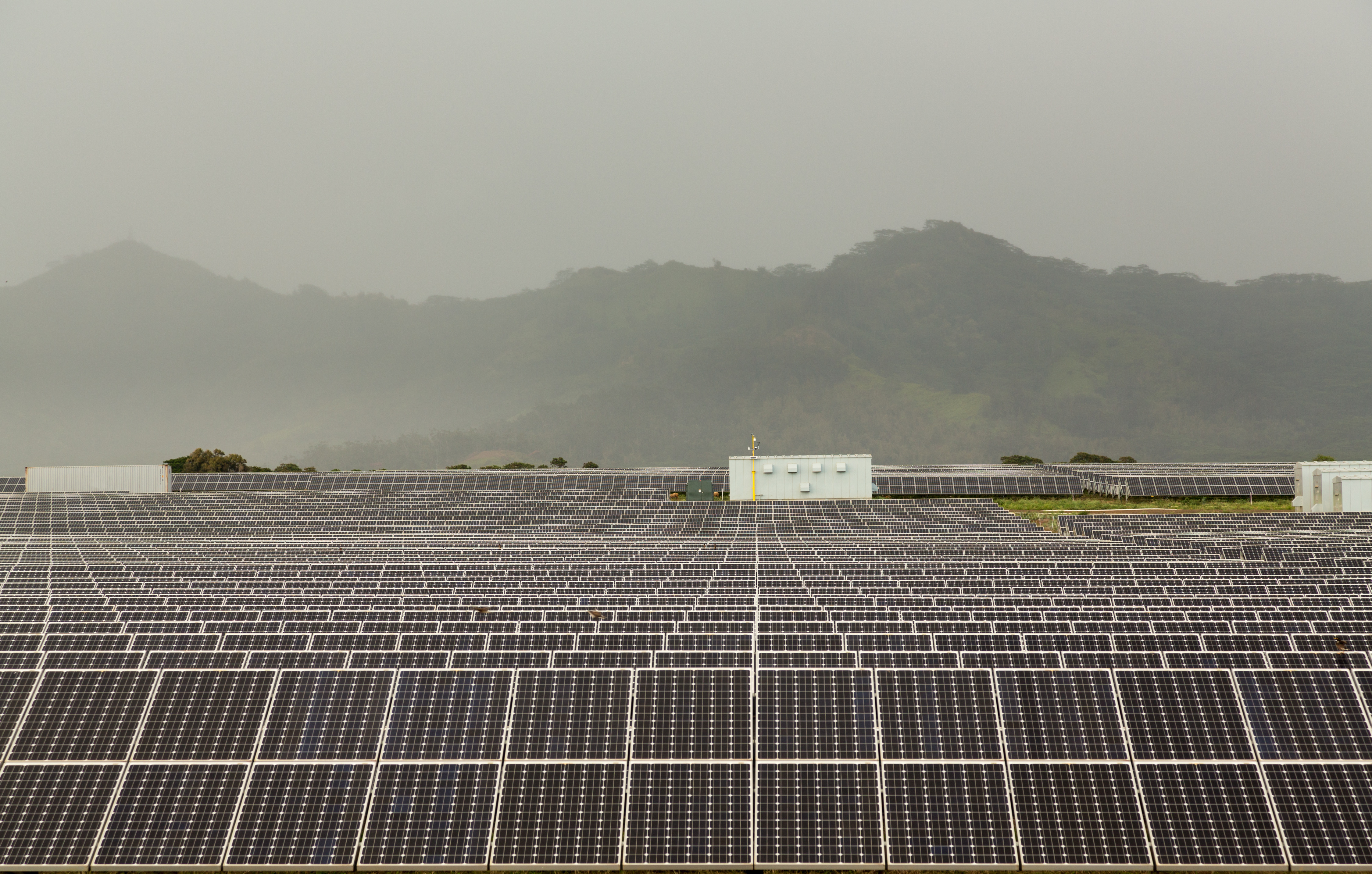 Solar panel power station on cloudy day