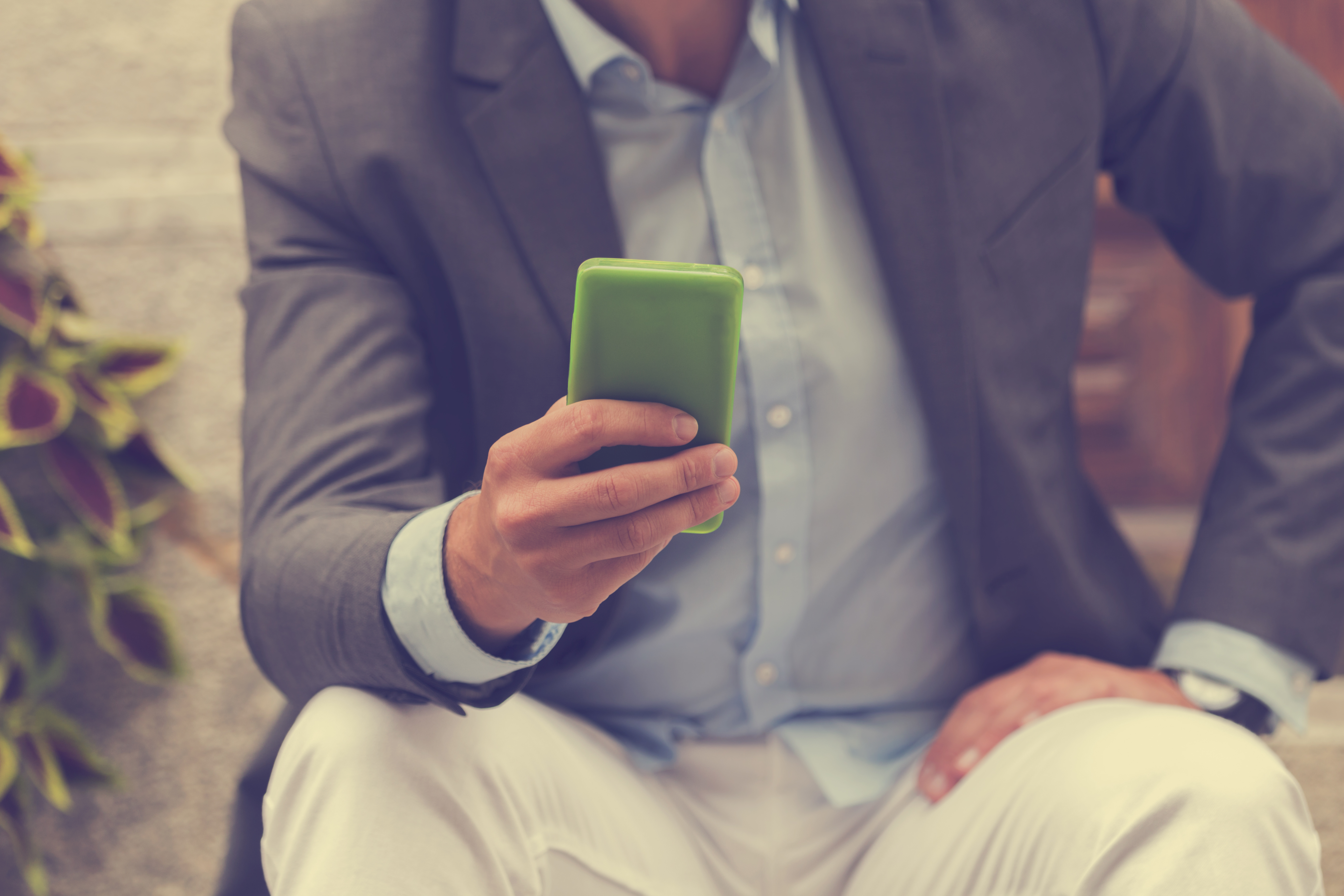 Handsome man using smartphone.