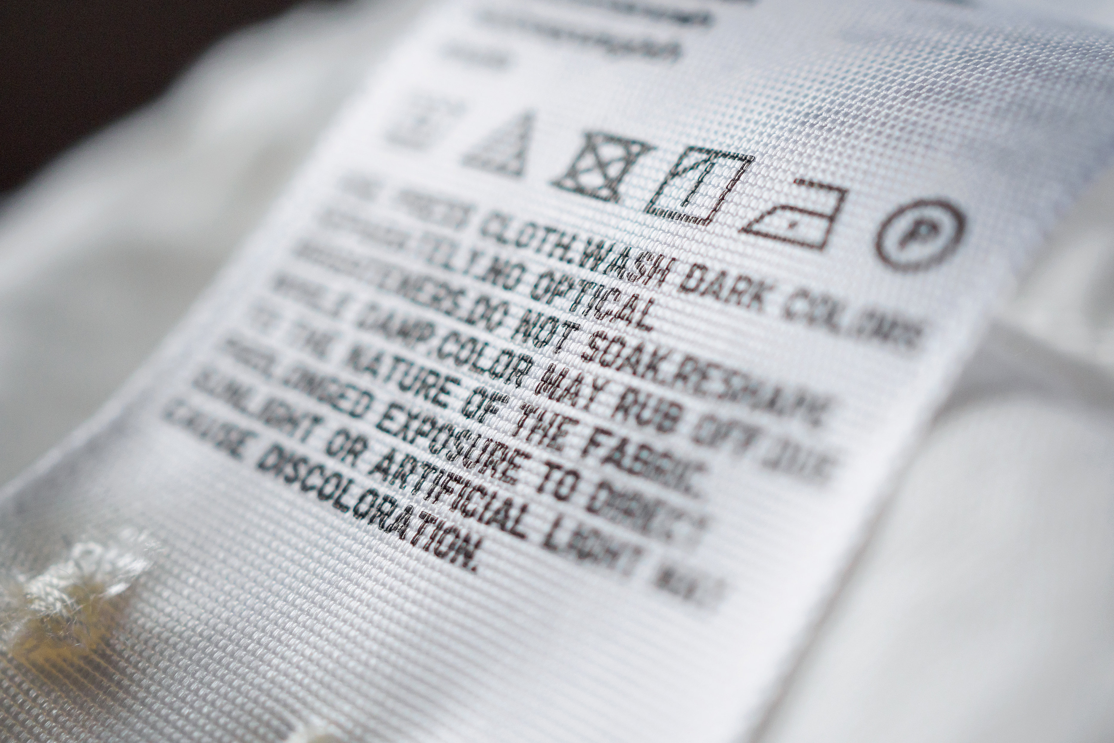 Cloth label tag with laundry care instructions.jpeg