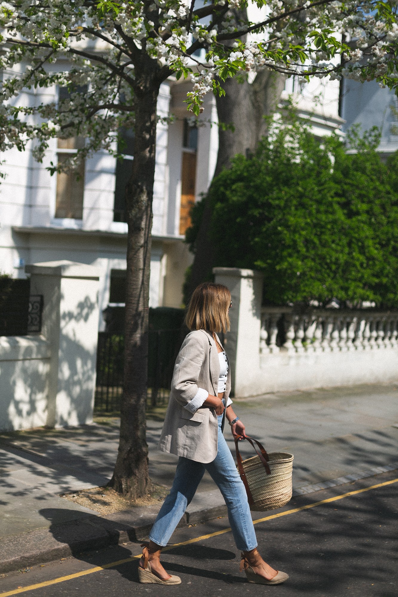 Emma-Hill-wears-linen-blazer-line-crop-top-light-weash-straight-leg-jeans-Loewe-basket-bag-wedge-espadrilles-bob-hair-chic-summer-outfit.jpg