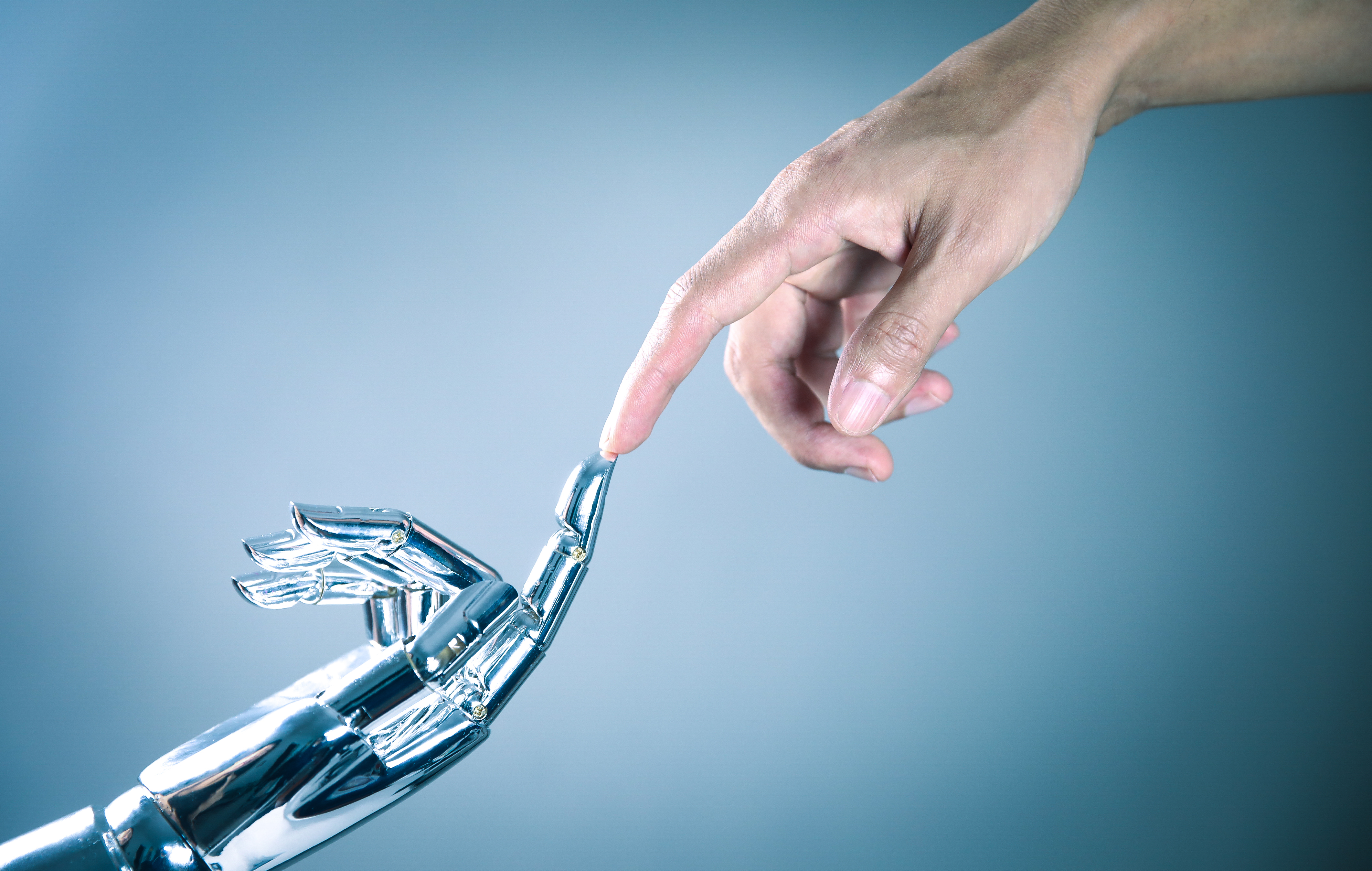 Human and robot hand connecting