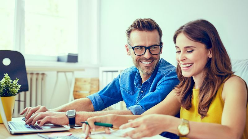 Happy couple saving for retirement