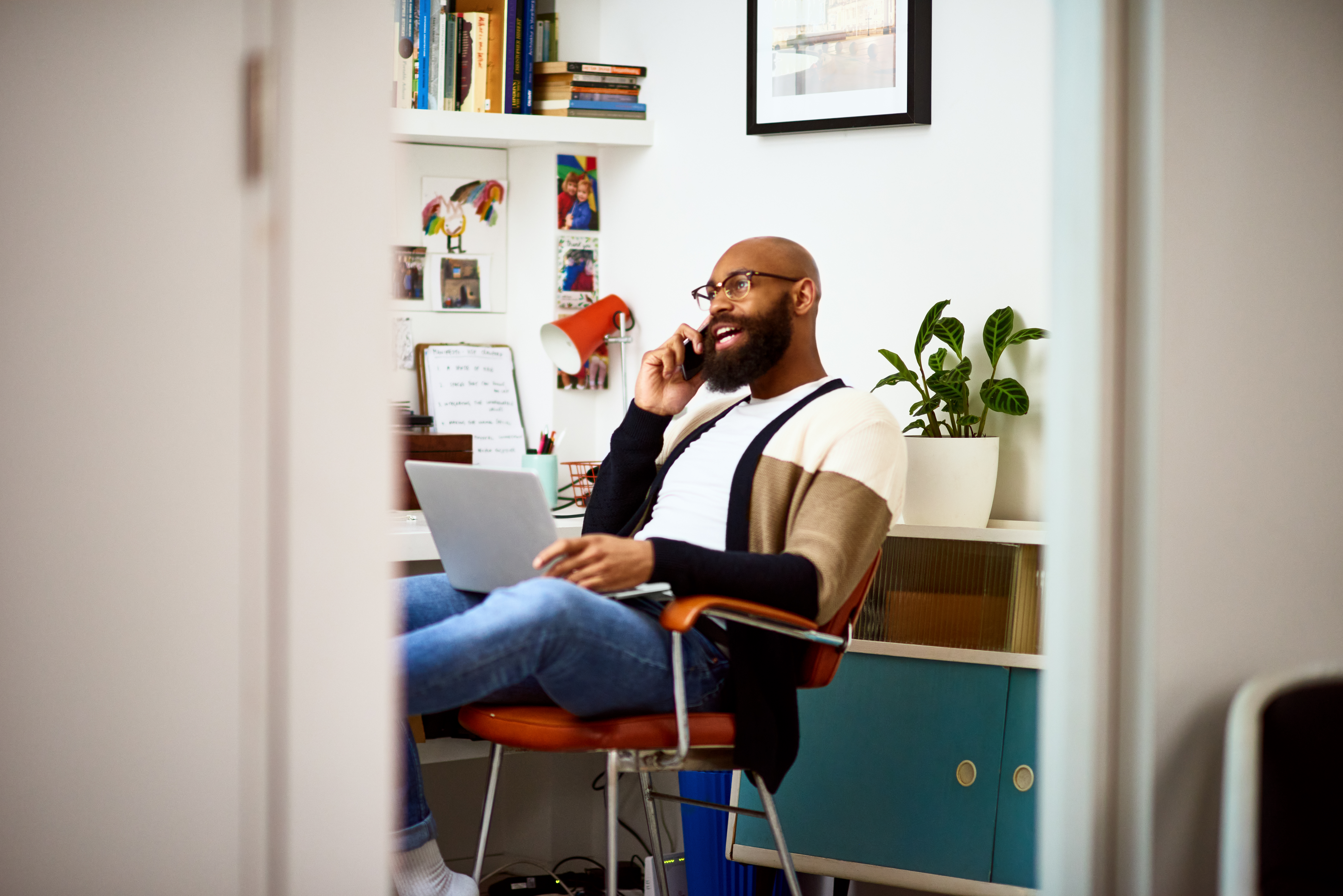 Small business owner on phone at home