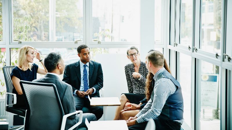 shareholders sitting around a table