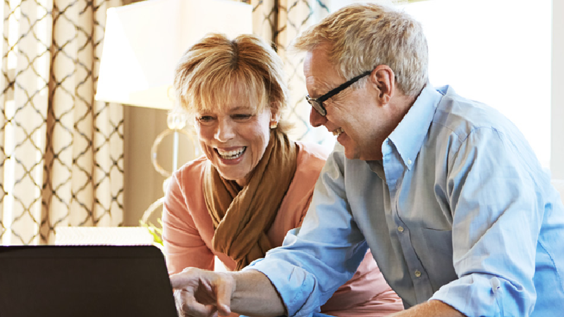 Couple looking at laptop