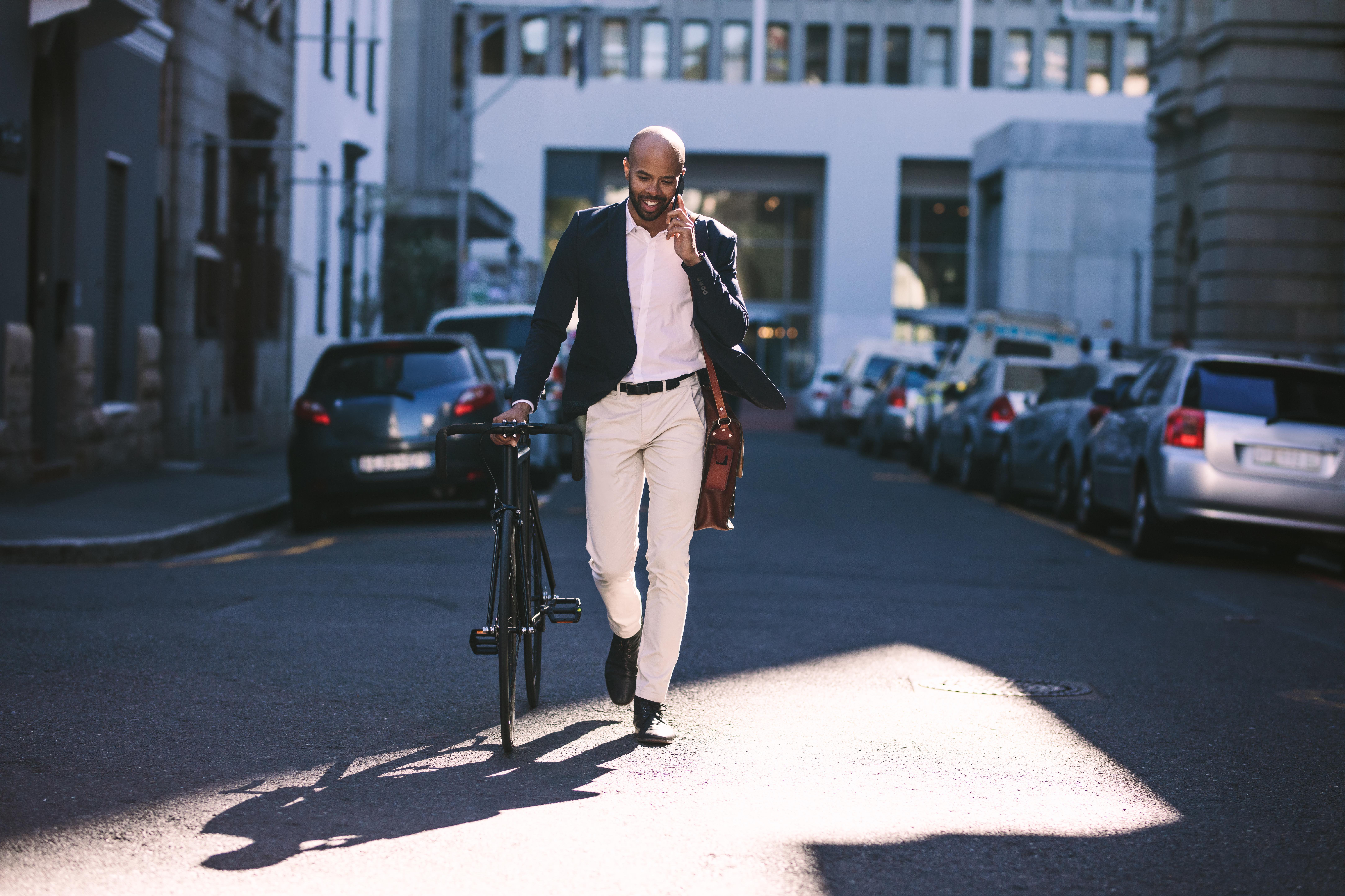 Young businessman going to work with his bicycle