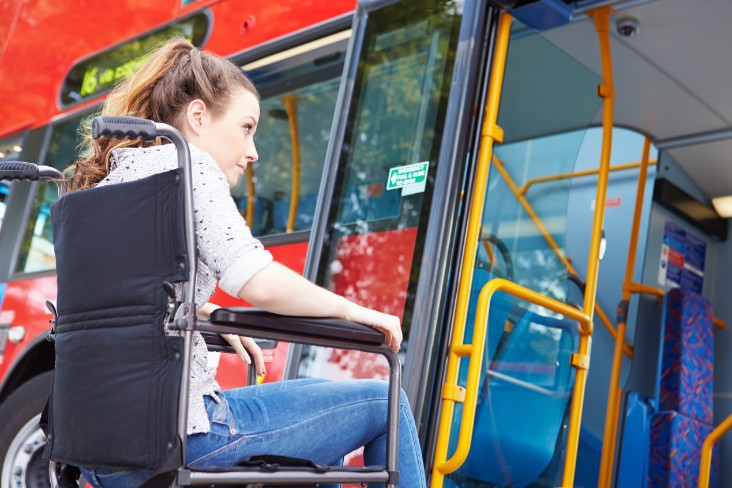 Wheelchair user boarding bus