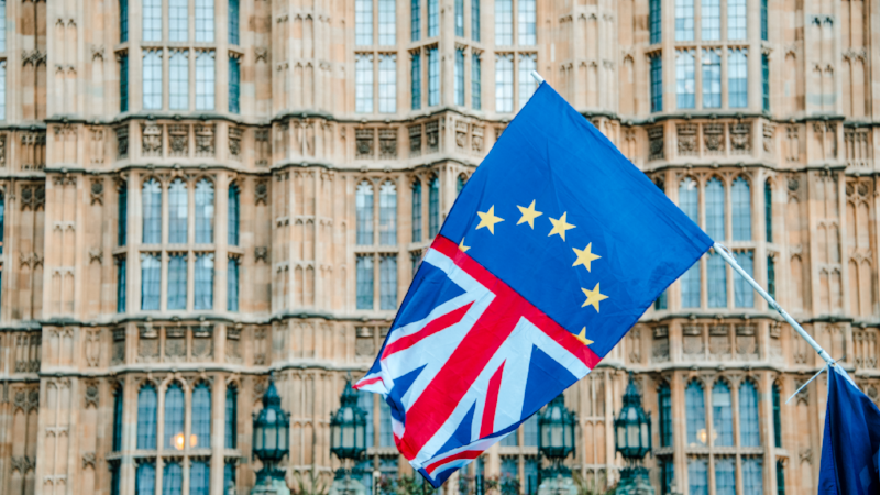 UK and EU flags merged by Houses of Parliament