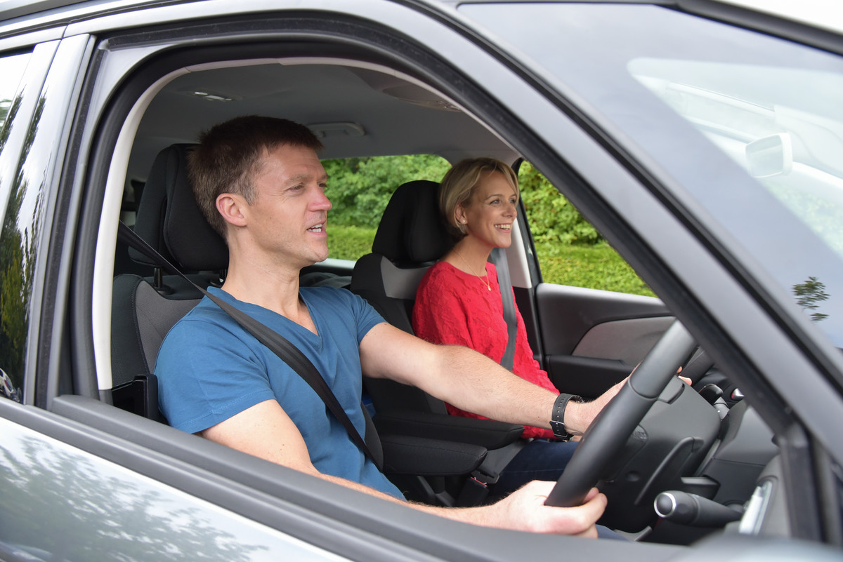 man driving car